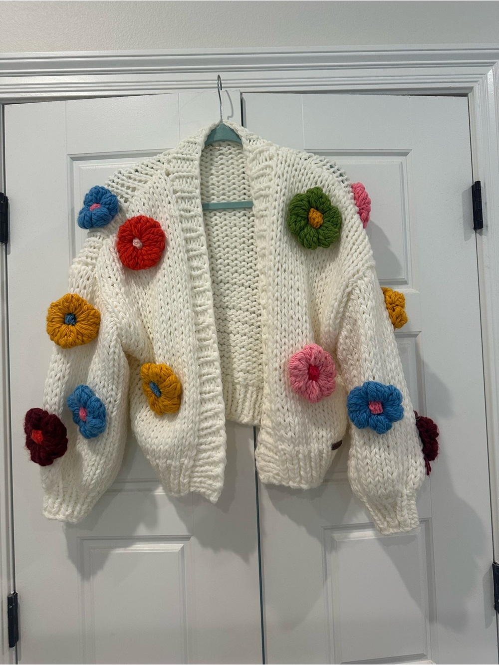 Chunky Cream Knit Cardigan with Colorful Crochet Flowers